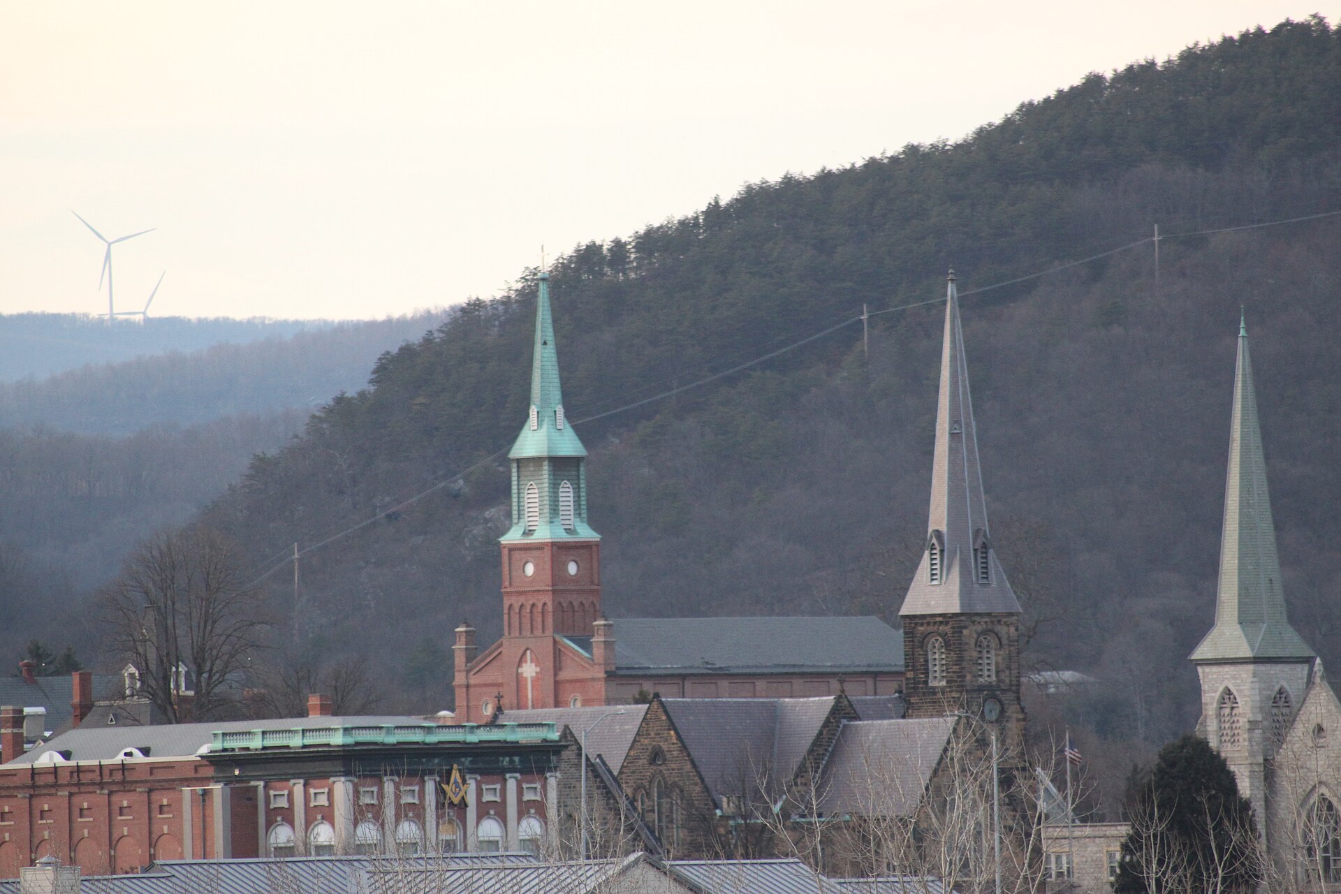 Downtown Cumberland, Maryland, its church spires and brick streets with the Allegheny ridges closing in behind