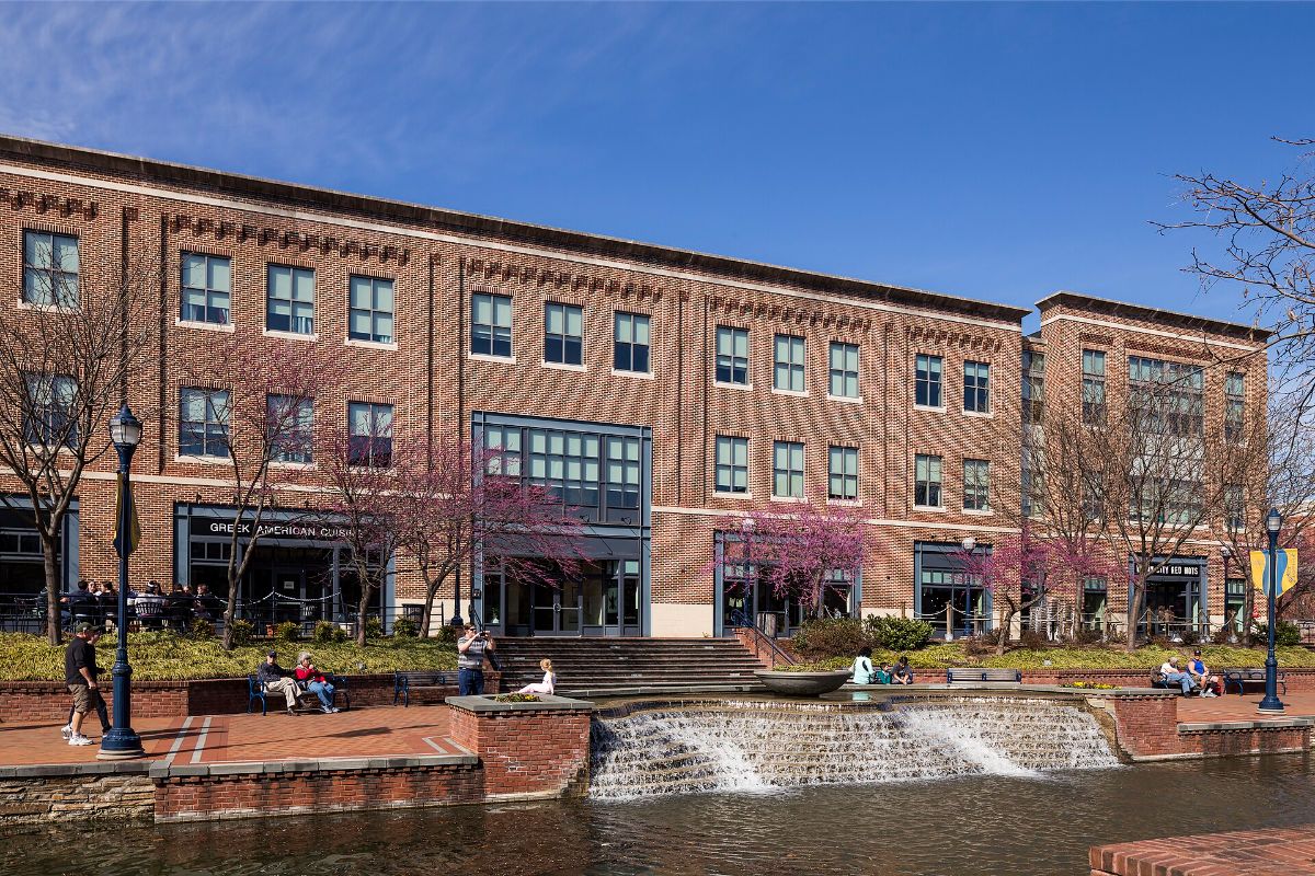 Brick storefronts and the stepped water feature along Carroll Creek Park in downtown Frederick